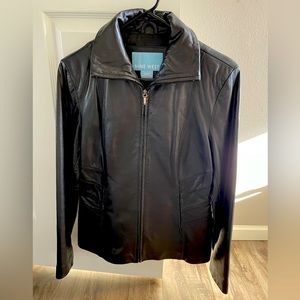 Leather jacket (not faux). Zip up, pockets, like new.